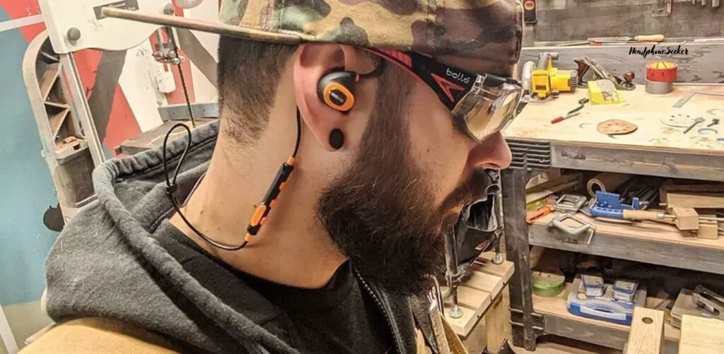 ISOtunes Sport Advance Shooting Earbuds wearing during the wood cutting